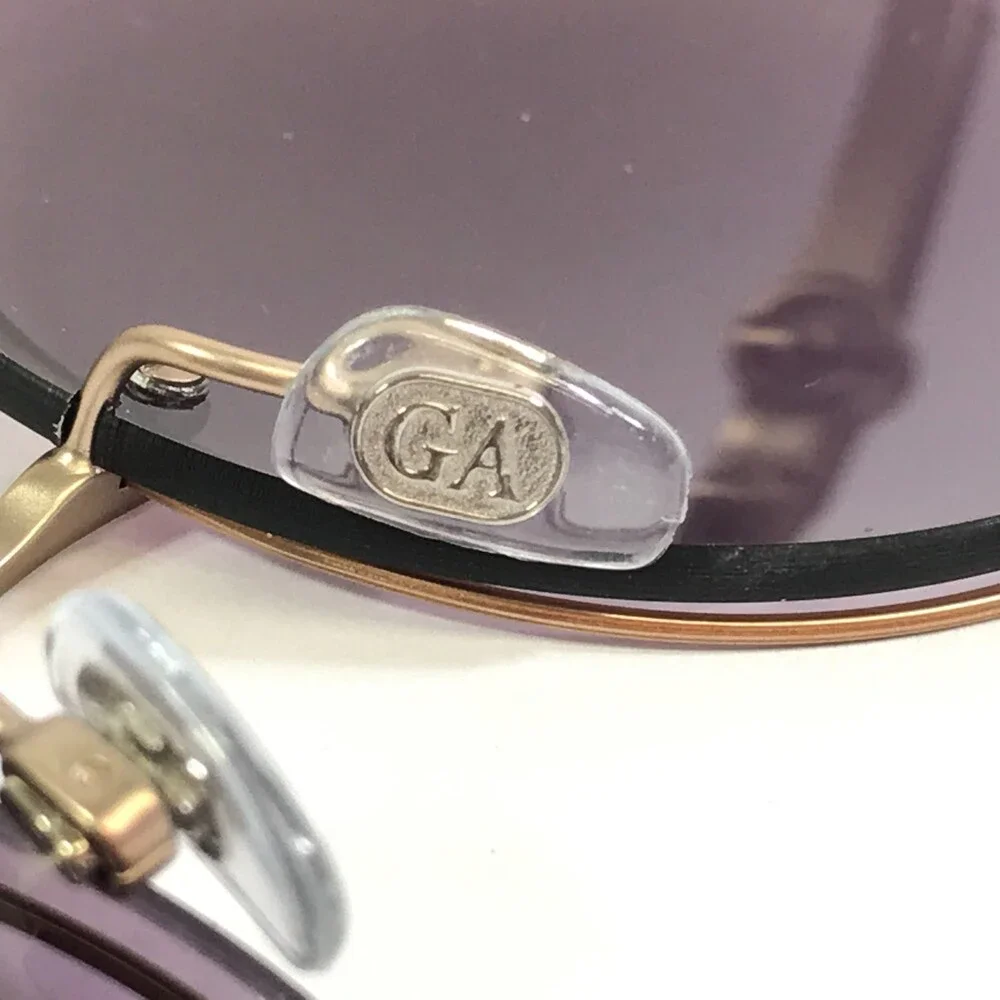 Giorgio Armani Sunglasses AR6043 3006/8H Gold Rimless Frames with Purple Lenses